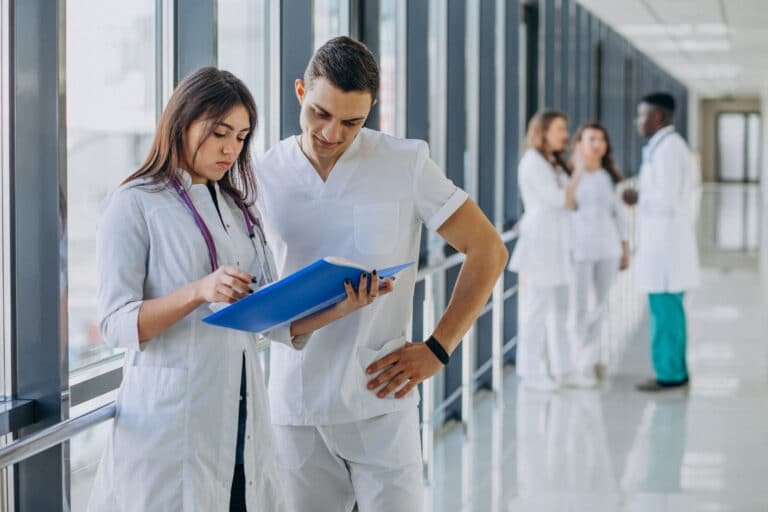 Two doctors meeting in hall